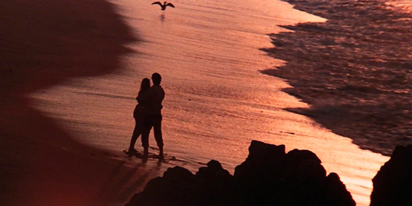 Danny and Sandy on the beach in the Grease prologue Image