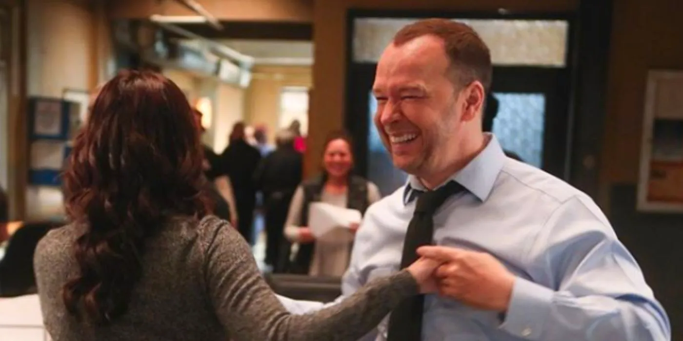 Danny (Donnie Wahlberg) and Baez (Marisa Ramirez) dancing in the office in Blue Bloods Image