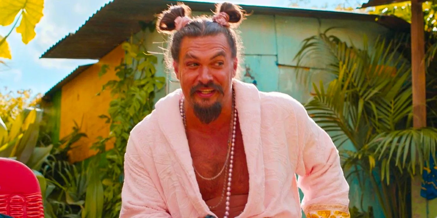 Dante (Jason Momoa) smiling with his hair up in buns in Fast X Image