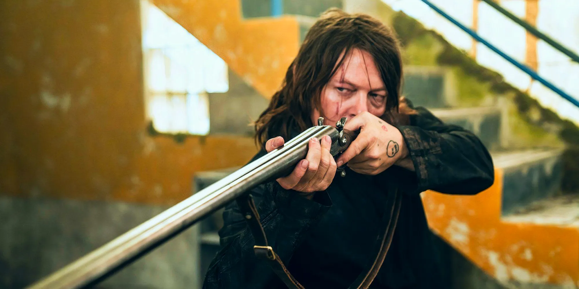 Daryl putting a gun in The Walking Dead Daryl Dixon season 2 Image