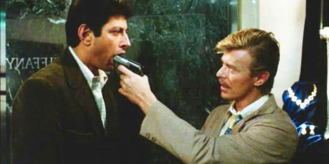 David Bowie in Into the Night 1985, David Bowie Putting A Gun into Jeff Goldblum's mouth Image