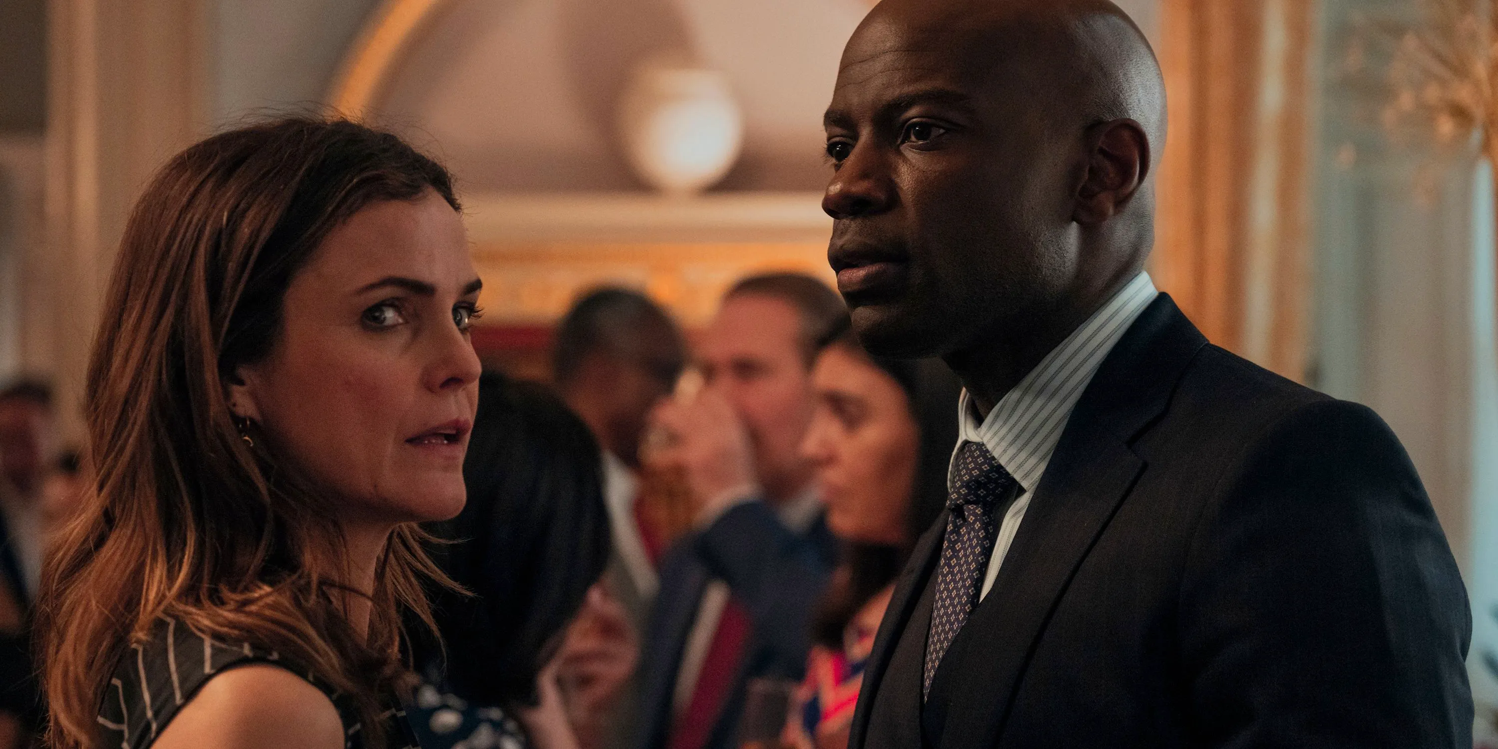 David Gyasi & Keri Russell in conversation during The Diplomat season 2 Image