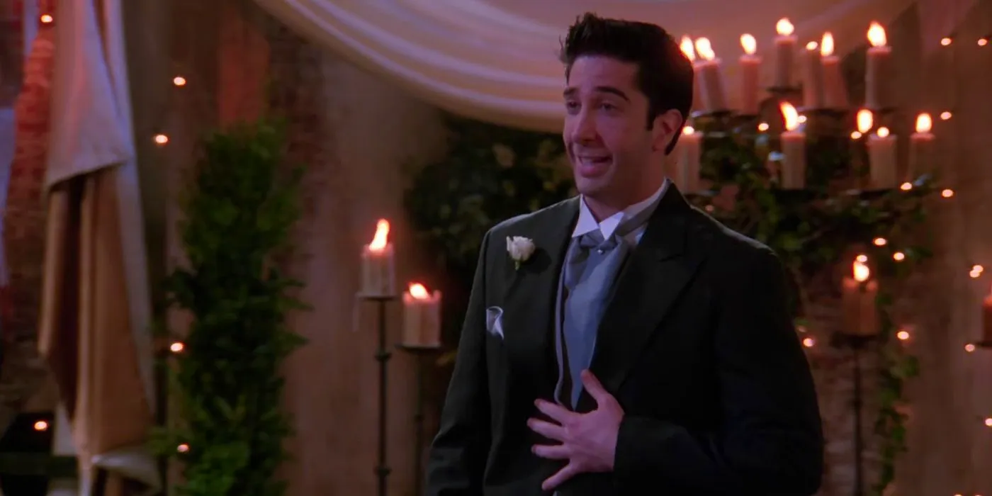 David Schwimmer as Ross Gellar looking surprised in a wedding suit in Friends Image