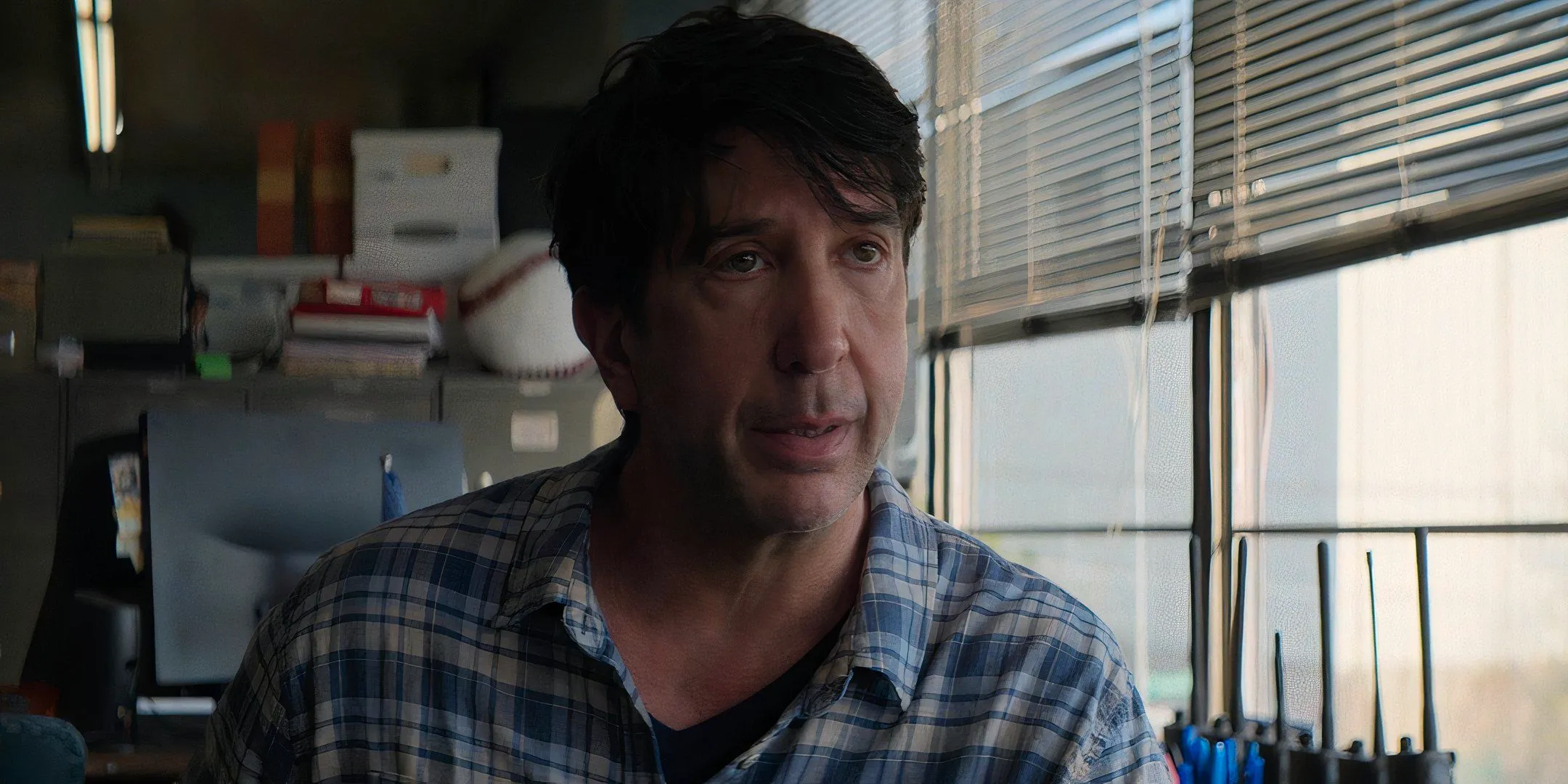 David Schwimmer's Anthony looking upset while talking to someone in Goosebumps The Vanishing Image