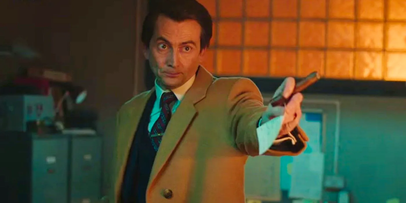 David Tennant holding out a piece of paper in Rivals Image