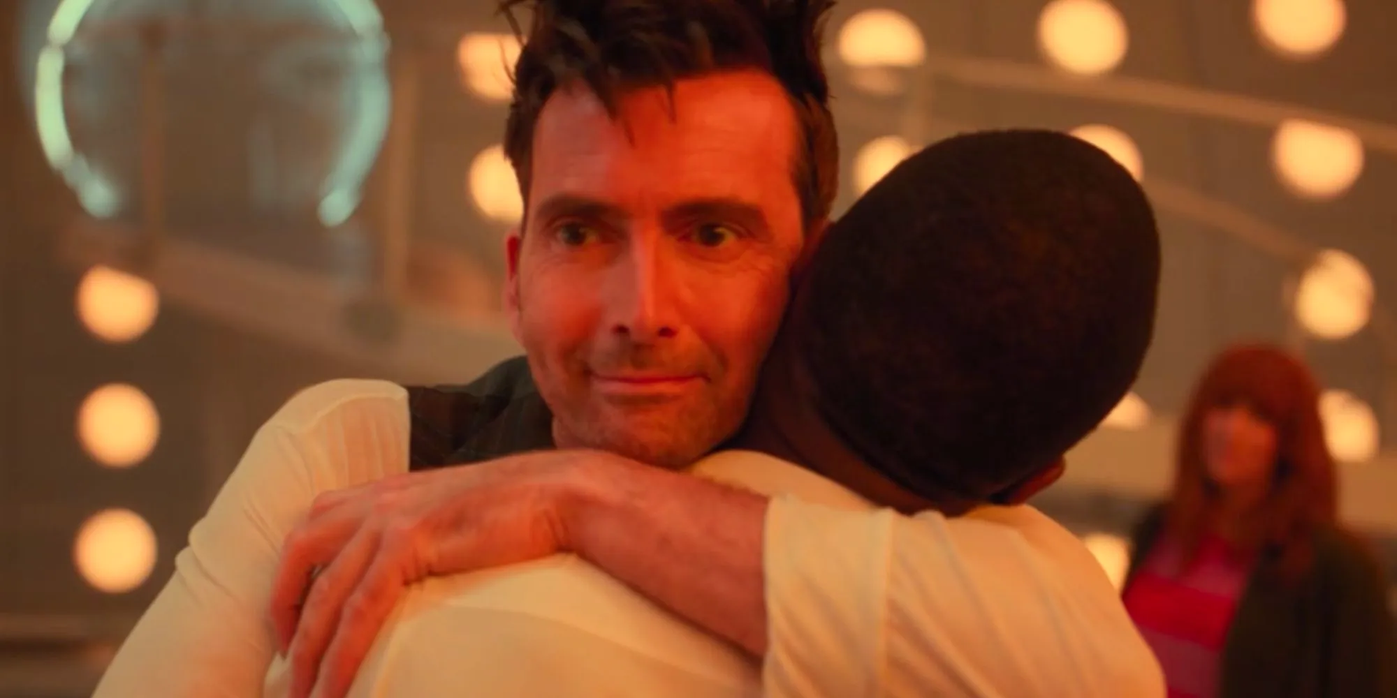 David Tennant's Fourteenth Doctor smiling in Doctor Who as he hugs Ncuti Gatwa's Fifteenth Doctor Image