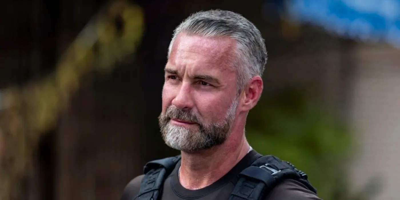 Deacon (Jay Harrington) looking at someone in SWAT. Image