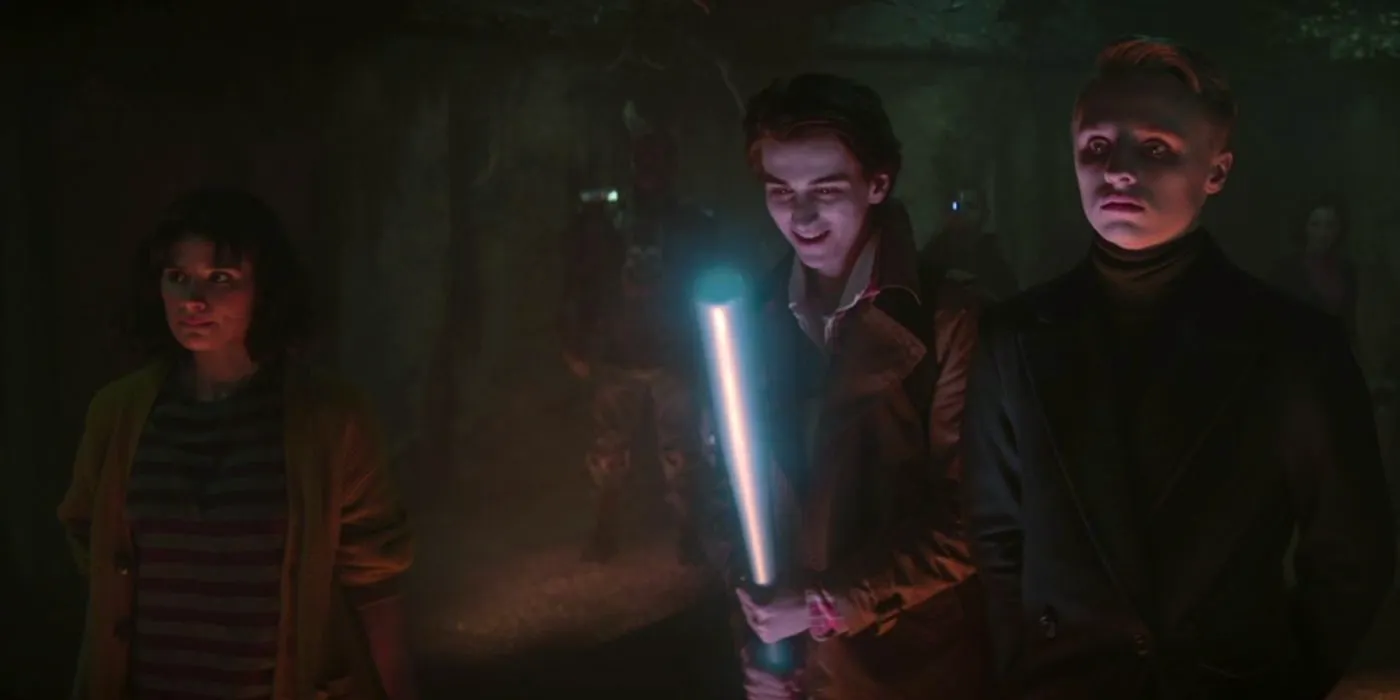 Dead Boy Detective Edwin (Ty Tennant) and Charles (Sebastian Croft) wielding a baseball bat in Doom Patrol. Image