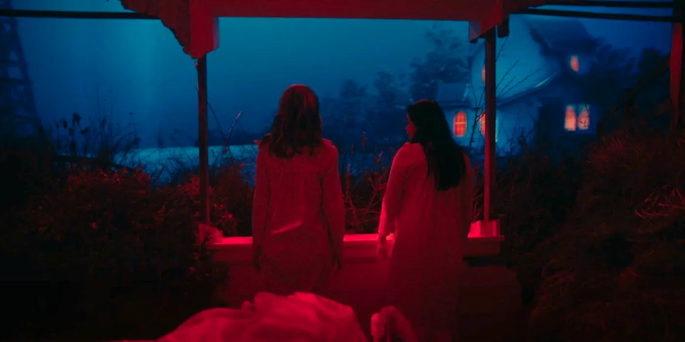 Debby Ryan's Jillian and Melonie Diaz's Mary look out on a dream world in American Horror Stories The Thing Under The Bed Image