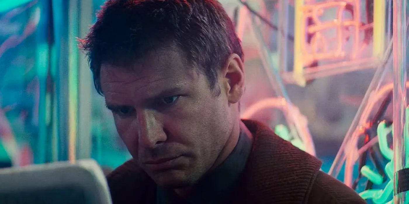 Deckard looking at a screen in Blade Runner Image