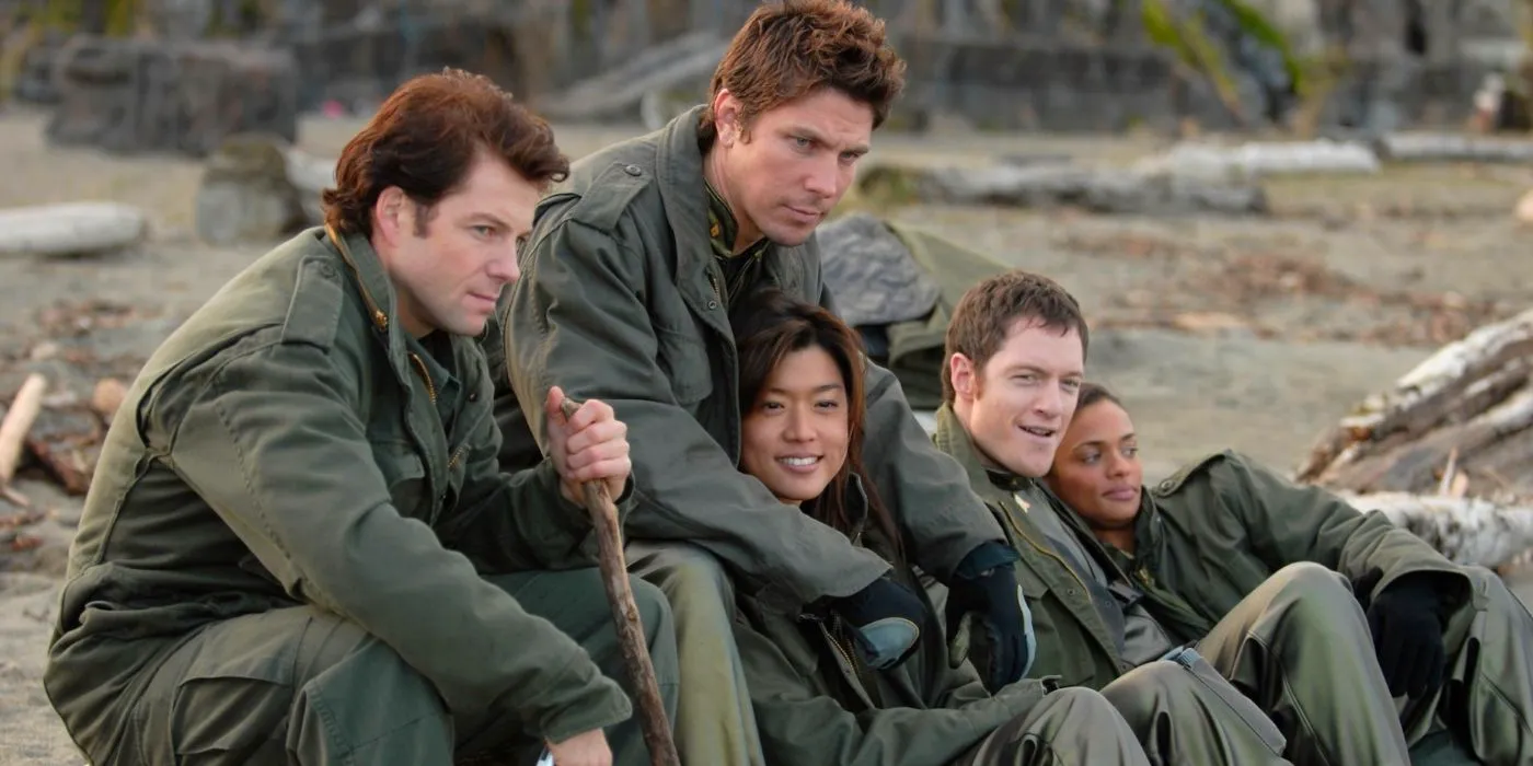 Dee, Sam Anders, Karl, Lee, and Sharon taking cover outdoors in Battlestar Galactica. Image