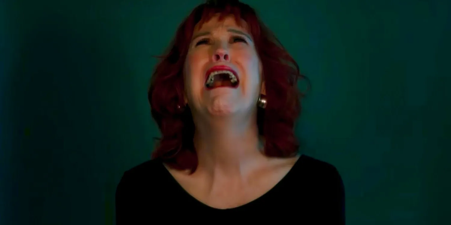 Delia (Catherine O'Hara) crying and wailing as part of an art performance in Beetlejuice Beetlejuice Image