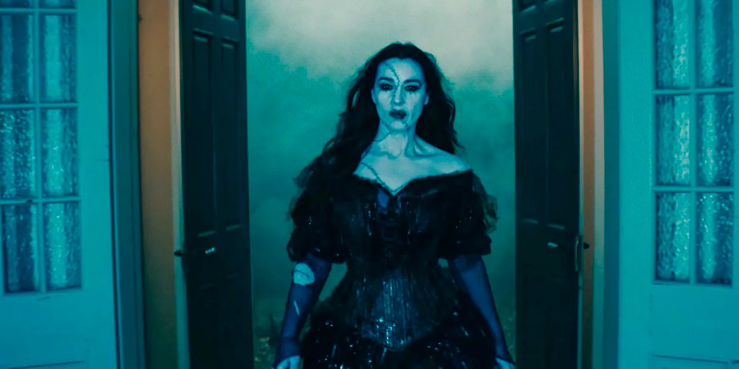 Delores (Monica Bellucci) appears through a door that opens wide in Beetlejuice 2 Image