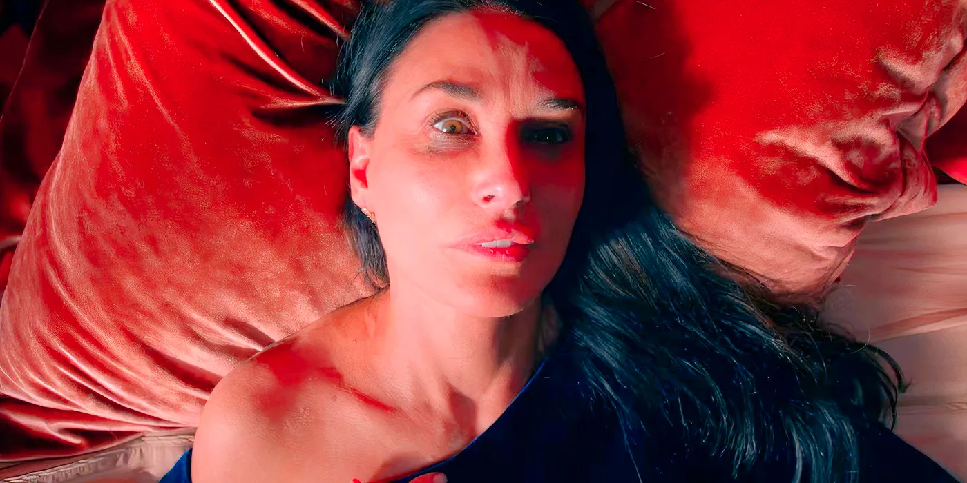 Demi Moore Lying on Her Bed Looking Scared in The Substance Image