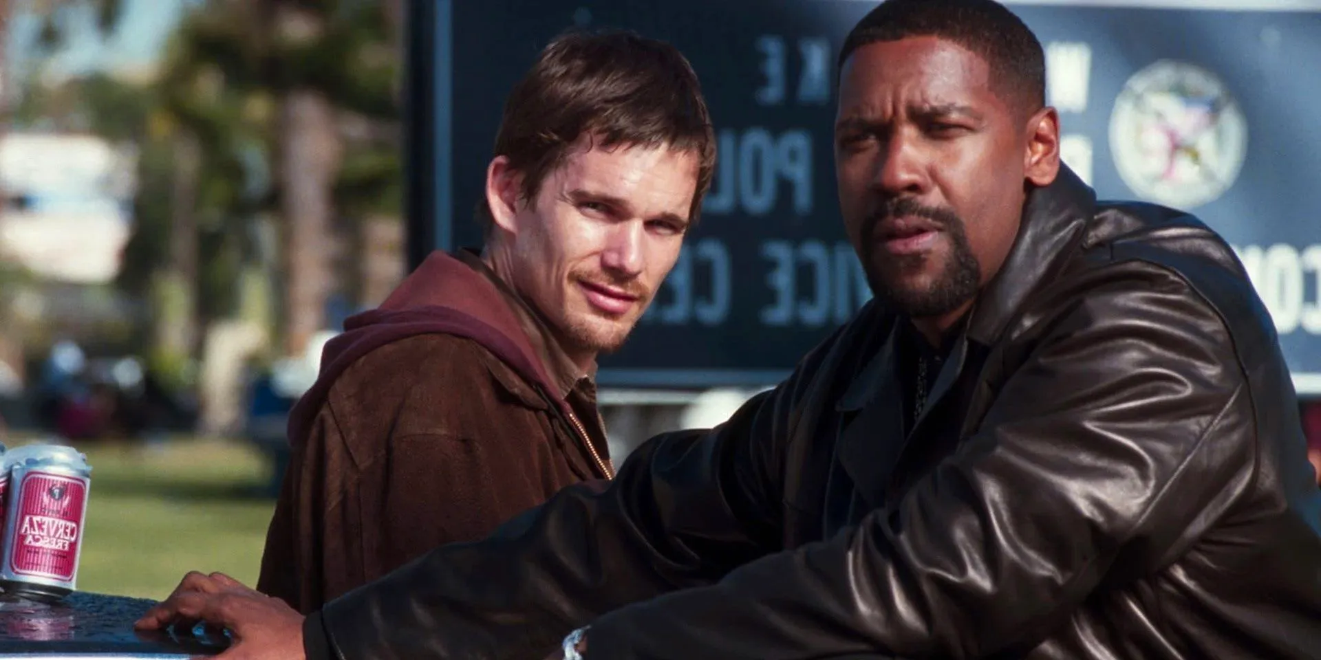 Denzel Washington and Ethan Hawke stand by the car in Training Day Image