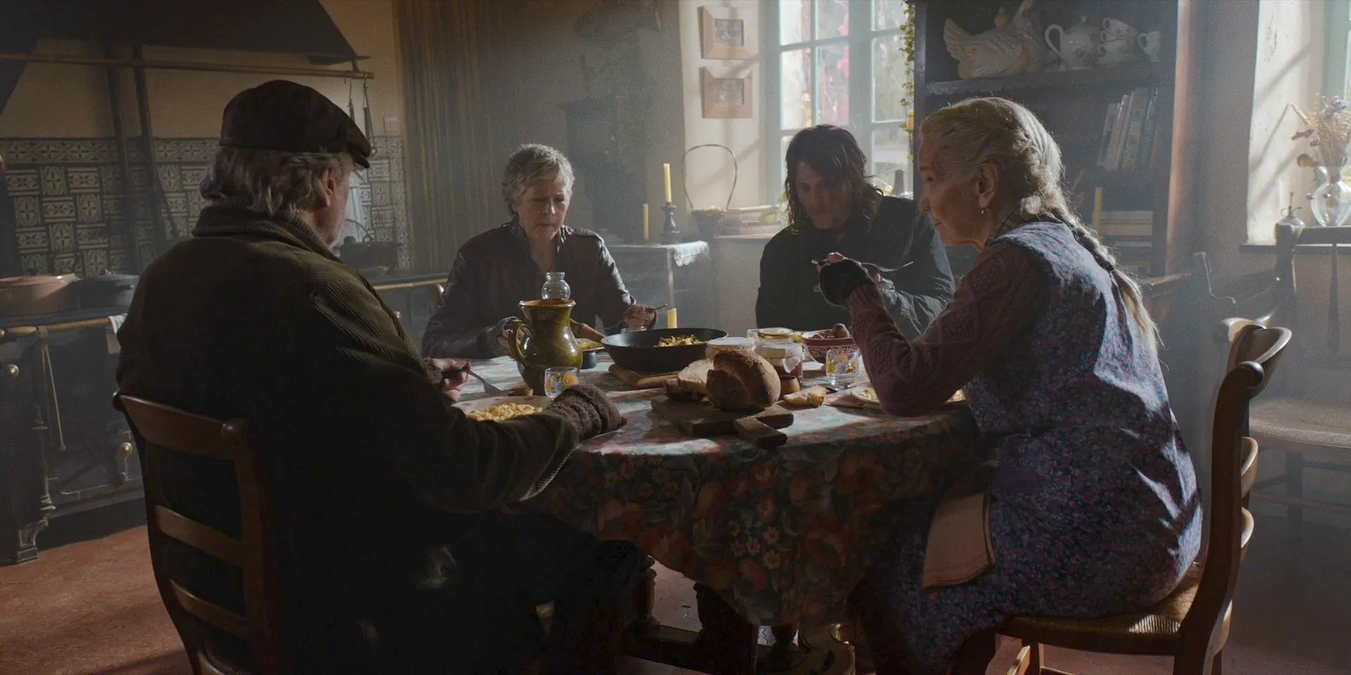 Didi, Daryl, Carol and Theo enjoying the meal in The Walking Dead: Daryl Dixon. Image