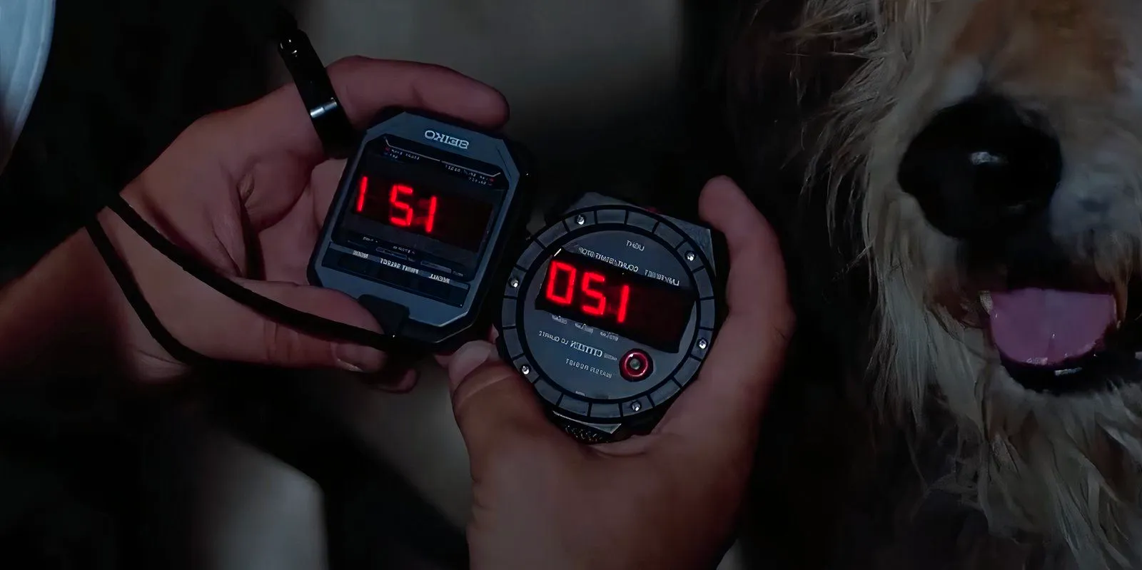 Doc Brown compairing the two stopwatches in Back to the Future, on reads 1:20 and the other says 1:21 Image