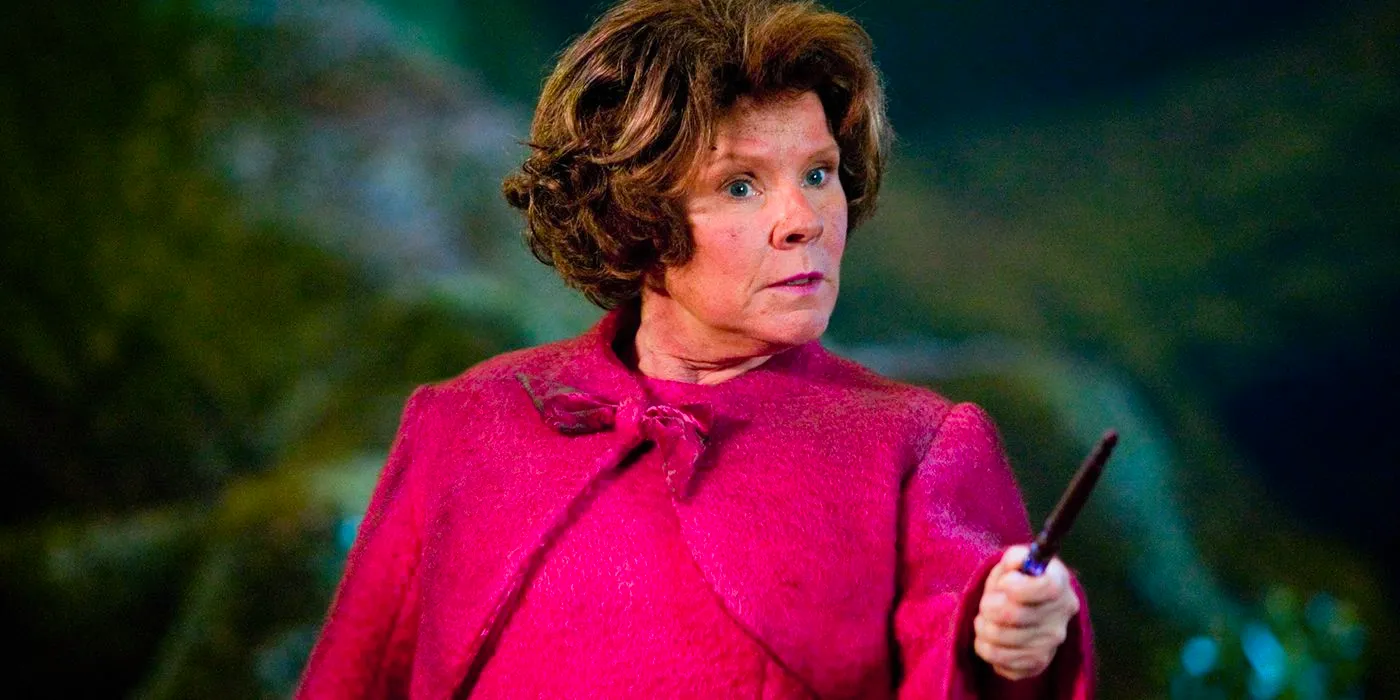 Dolores Umbridge holding out her wand in Harry Potter.  Image