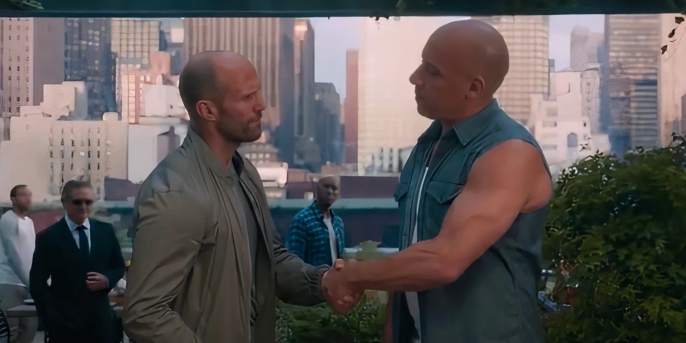 Dominic Toretto and Deckard Shaw shaking hands in The Fate of the Furious (2017) Image