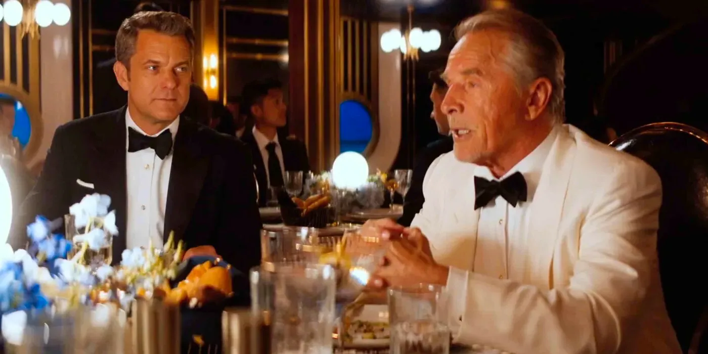 Don Johnson and Joshua Jackson sitting at a table for dinner in Doctor Odyssey Image