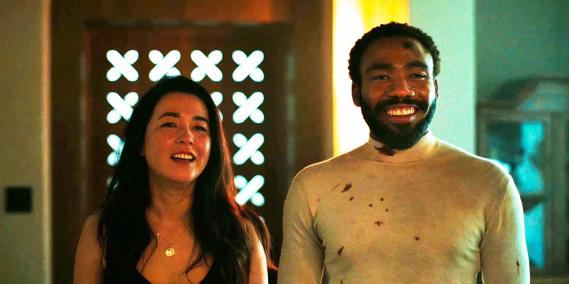 Donald Glover and Maya Erskine in John and Jane laughing together in Mr. & Mrs. Smith episode 8 Image