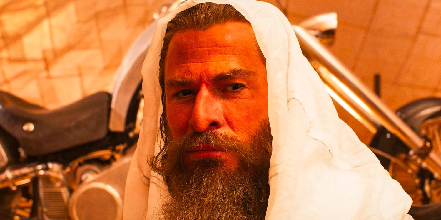 Dr. Dementus (Chris Hemsworth) with his head covered by a white cloak in Furiosa Image