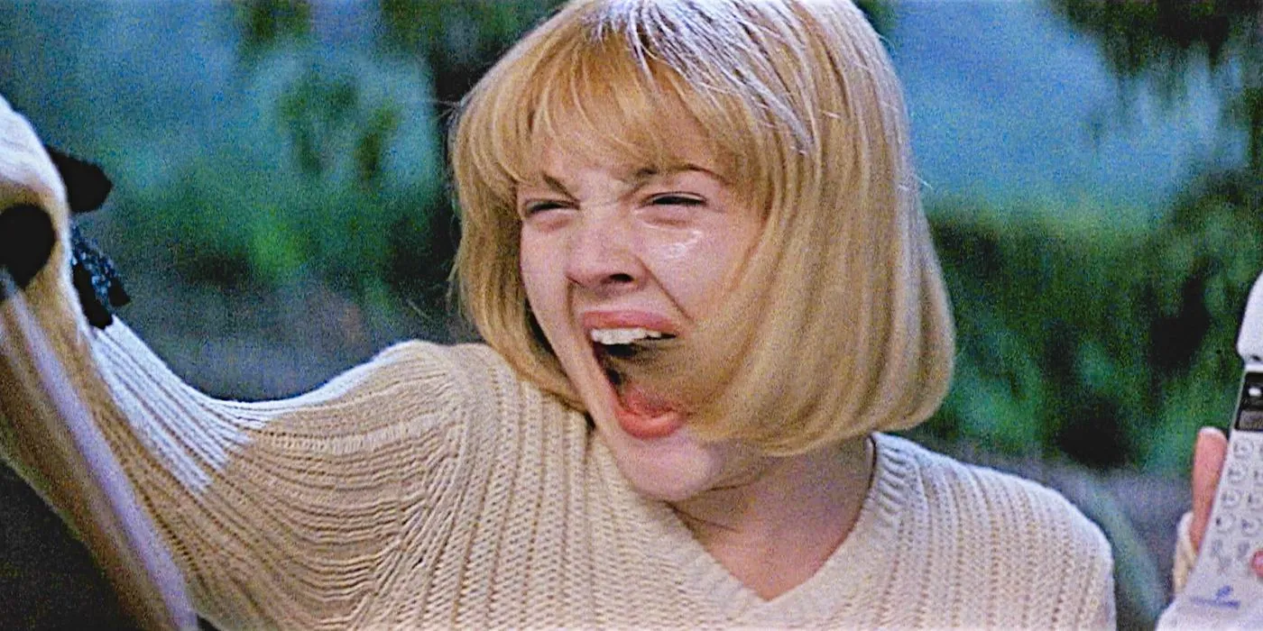 Drew Barrymore as Casey screams as she is grabbed by Ghostface in Scream. Image