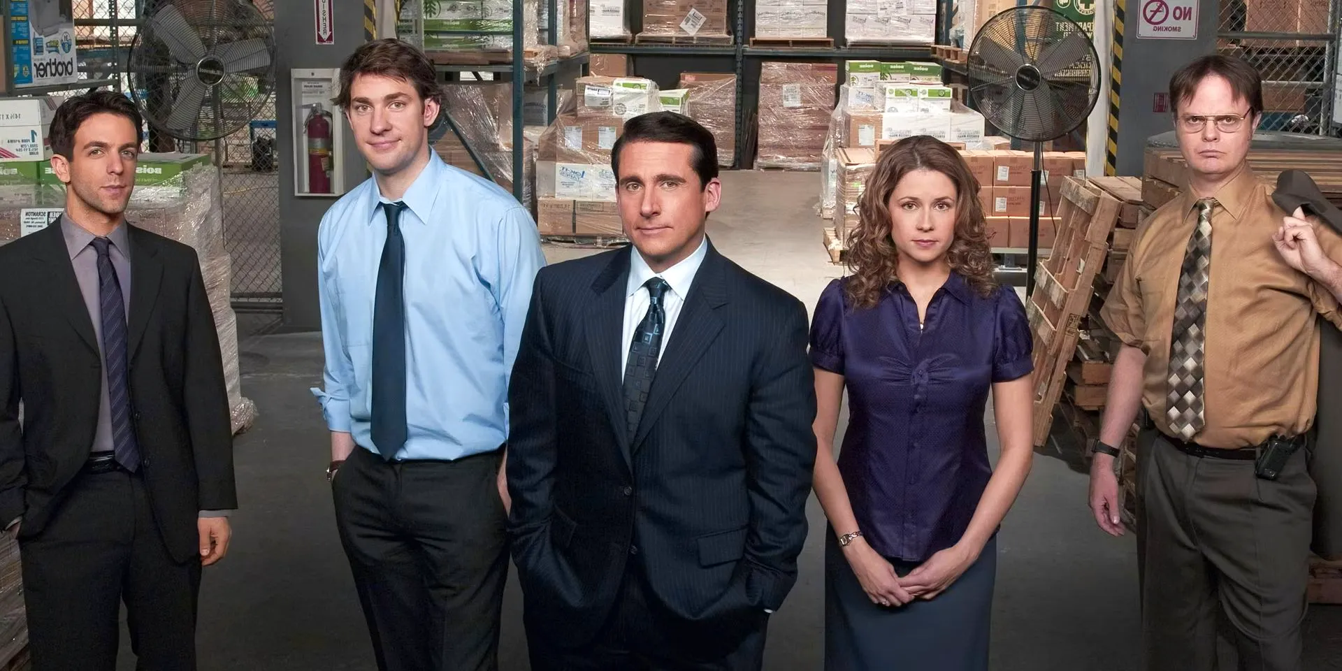 Dwight, Pam, Michael, Jim, and Ryan pose for a promo shot in the storage warehouse on The Office Image