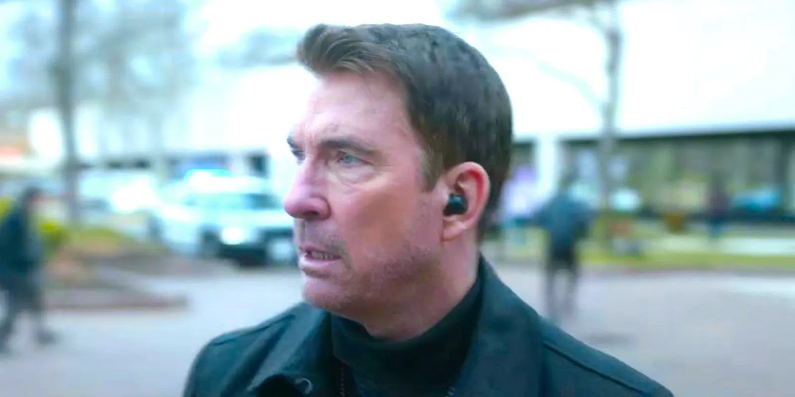 Dylan McDermott as Remy Scott looking worried as people flee from a bomb in FBI Most Wanted season 5. Image