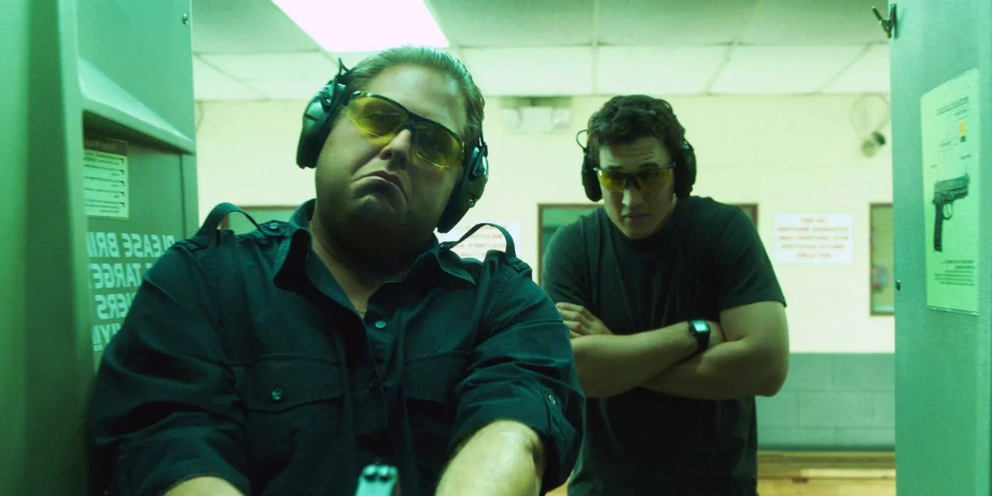 Efraim and David at a gun range in War Dogs Image