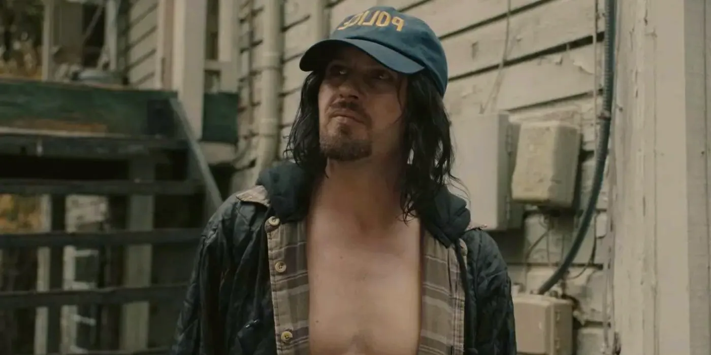 Eli Phillips played by Michael Pitt wearing a Police hat in Reptile Image