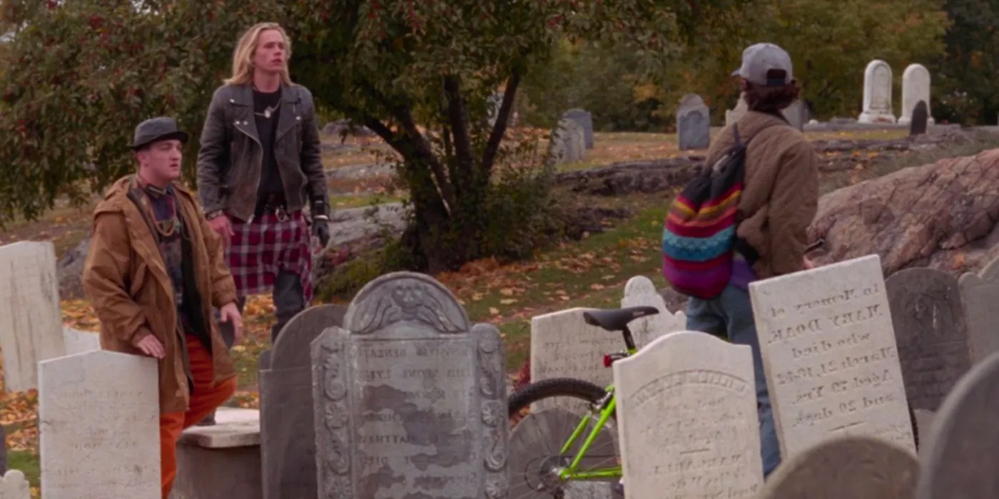 Elijah (Steve Voboril) and Jay (Tobias Jelinek) talkig to Max (Omri Katz) at the cemetary in Hocus Pocus Image