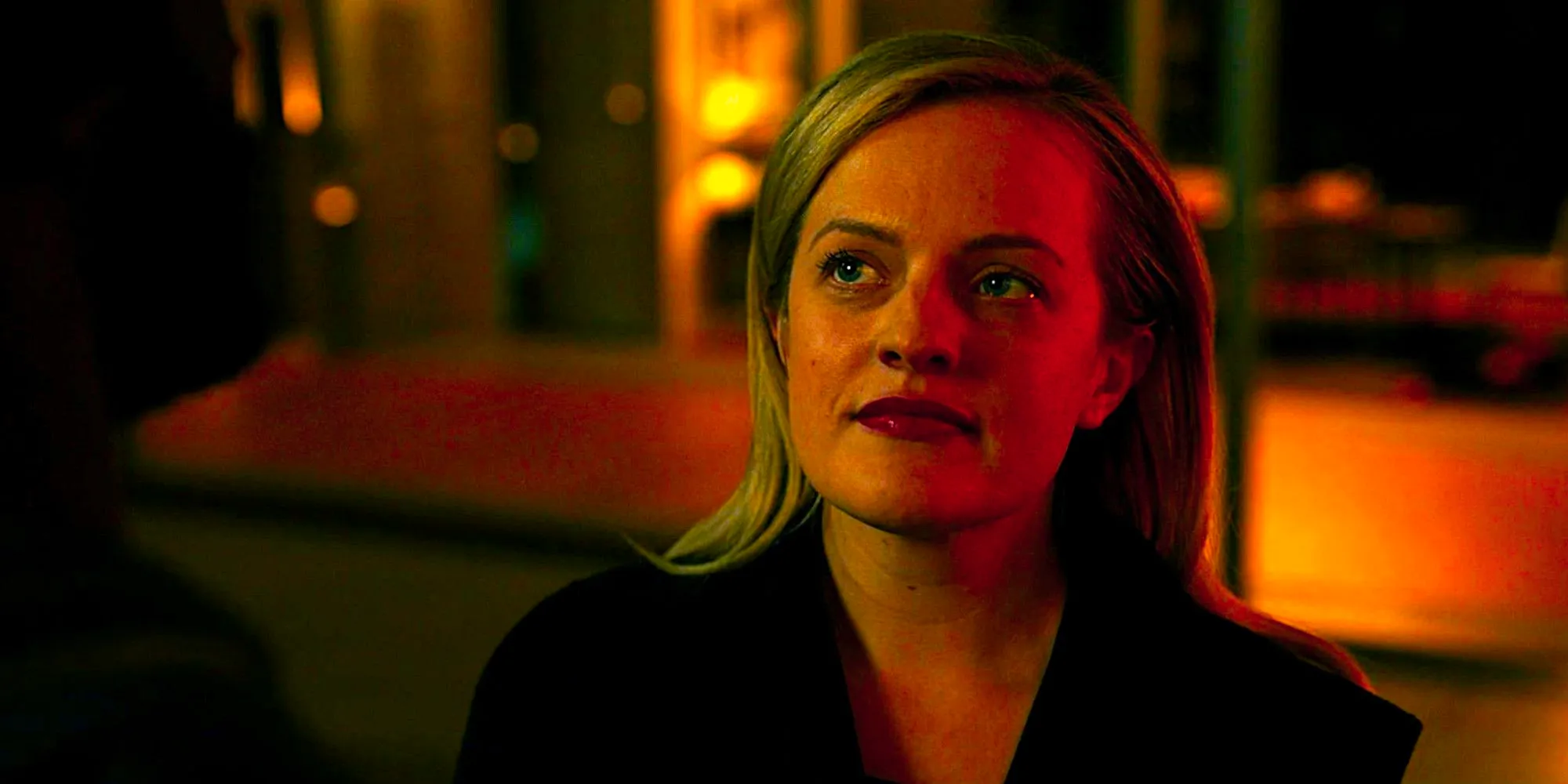 Elisabeth Moss looks upward mysteriously in The Invisible Man Image