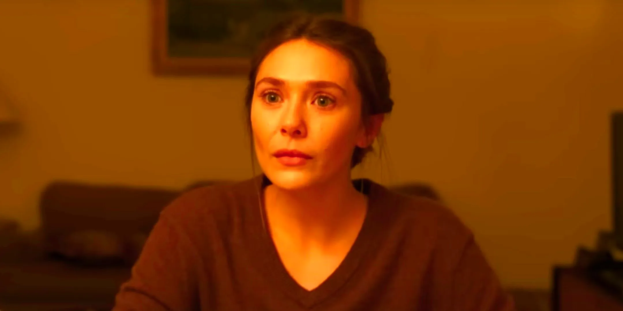 Elizabeth Olsen reacts with a blank stare in His Three Daughters Image