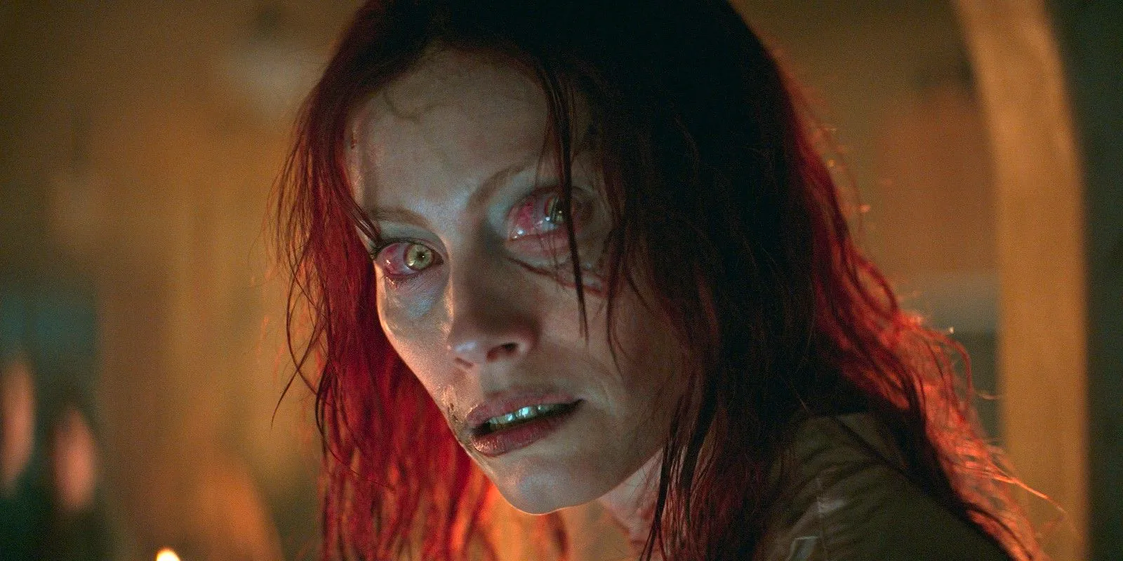 Ellie (Alyssa Sutherland) looks angrily over her shoulder as a possessed Deadite in Evil Dead Rise Image