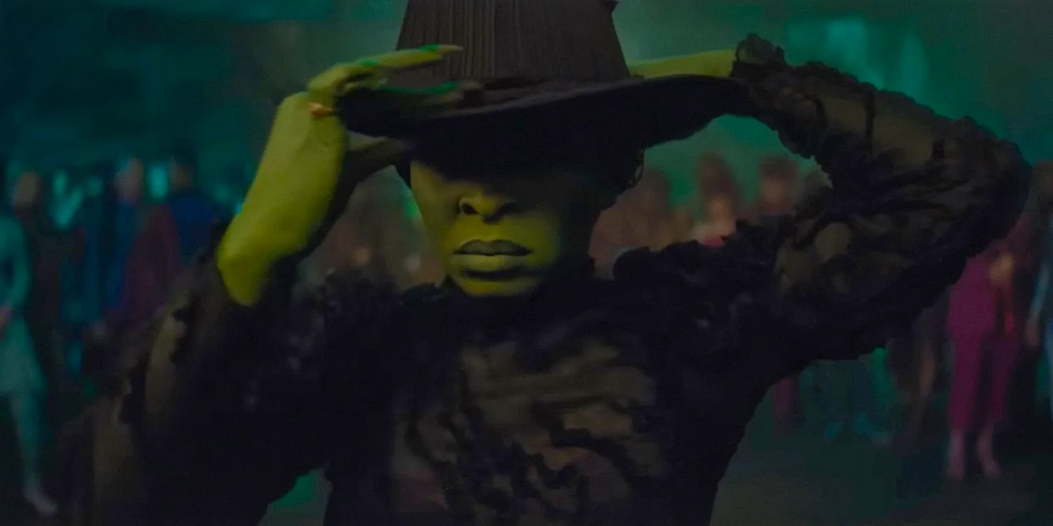 Elphaba (Cynthia Erivo) putting on her witch hat in Wicked  Image