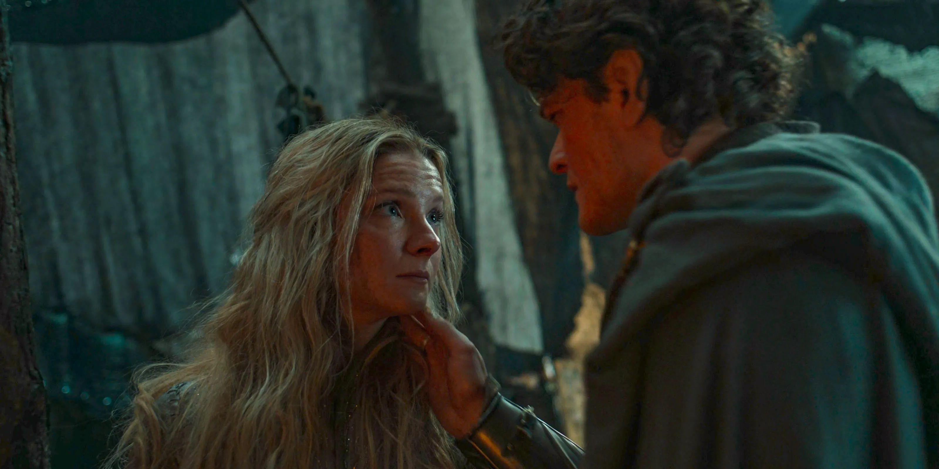 Elrond (Robert Aramayo) secretly gives a brooch to Galadriel (Morfydd Clark) as they say goodbye in The Lord of the Rings: The Rings of Power Season 2 Episode 7 Image