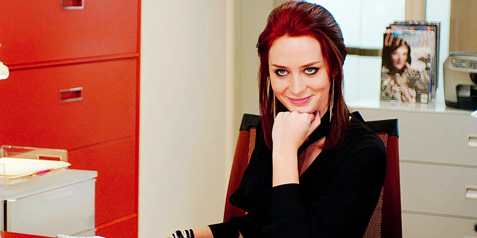 Emily Blunt smiling as Emily in The Devil Wears Prada Image