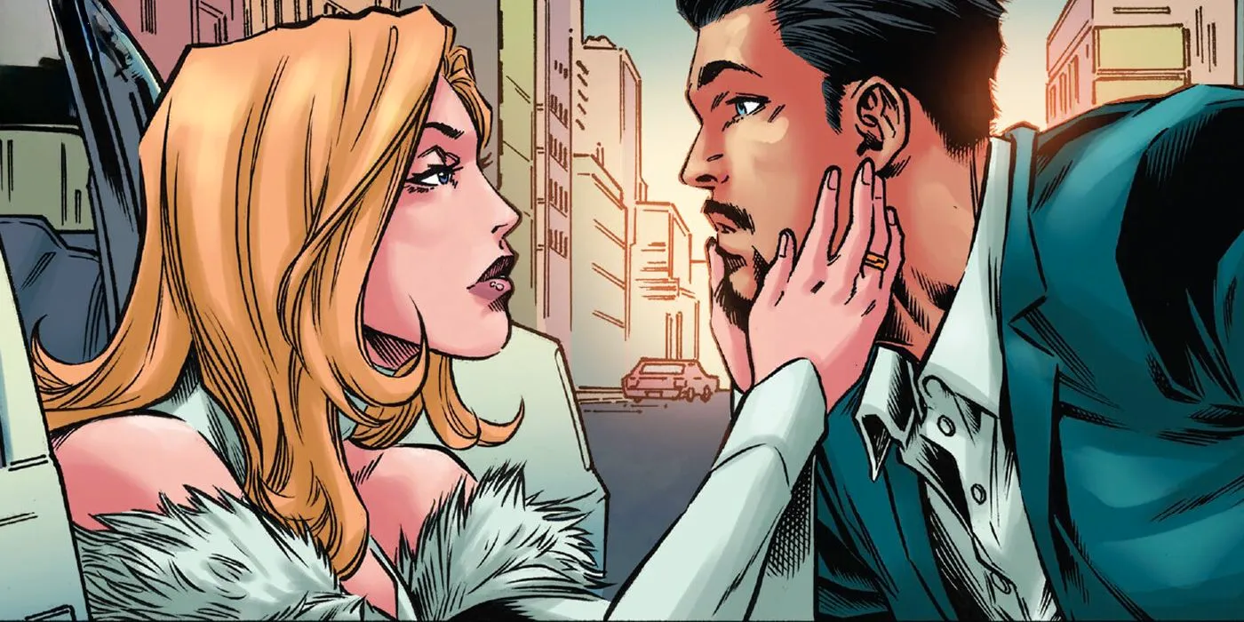 Emma Frost holds Tony Stark's face in her hands as the two are about to part for the last time. Image