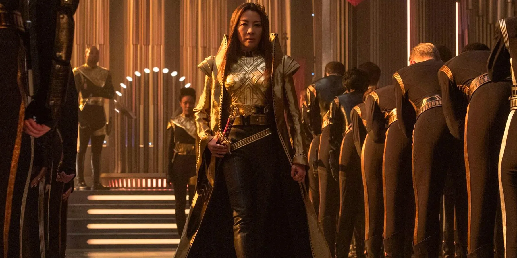 Emperor Phillipa Georgiou strides down a line of people in Star Trek: Discovery season 1. Image