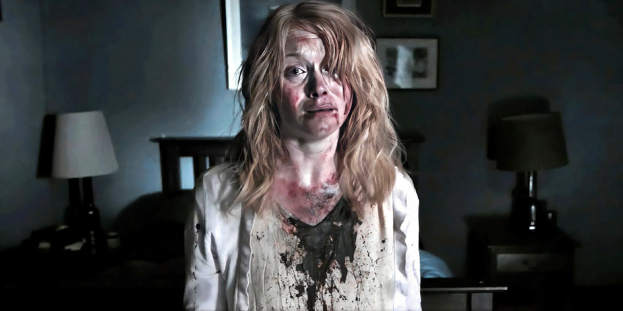 Essie Davis as Amelia with a bloody shirt and looking tired in The Babadook Image