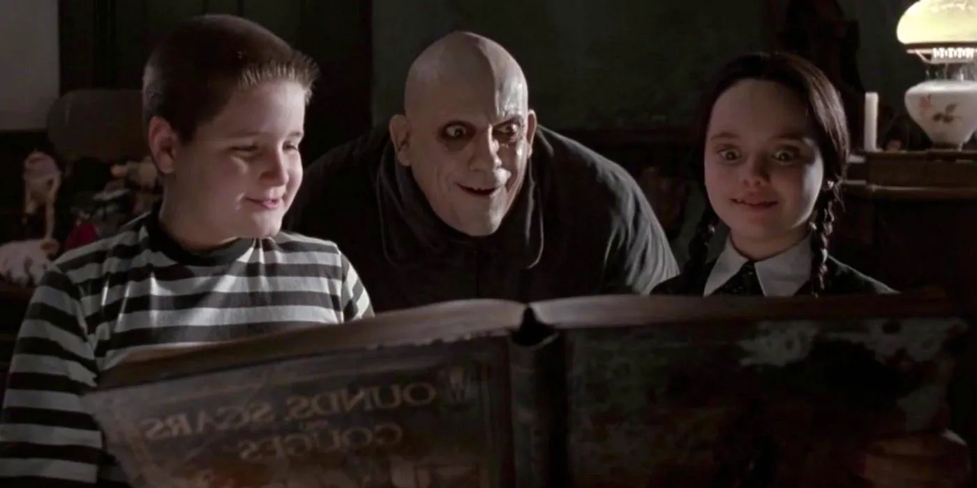 Fester looking at an old book with Wednesday and Pugsley in The Addams Family Image