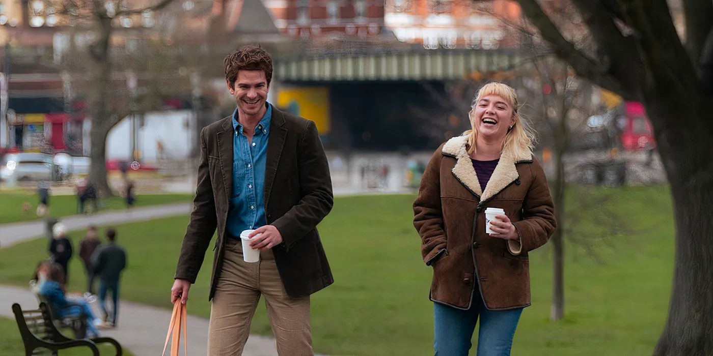 Florence Pugh and Andrew Garfield laugh together in We Live in Time Image