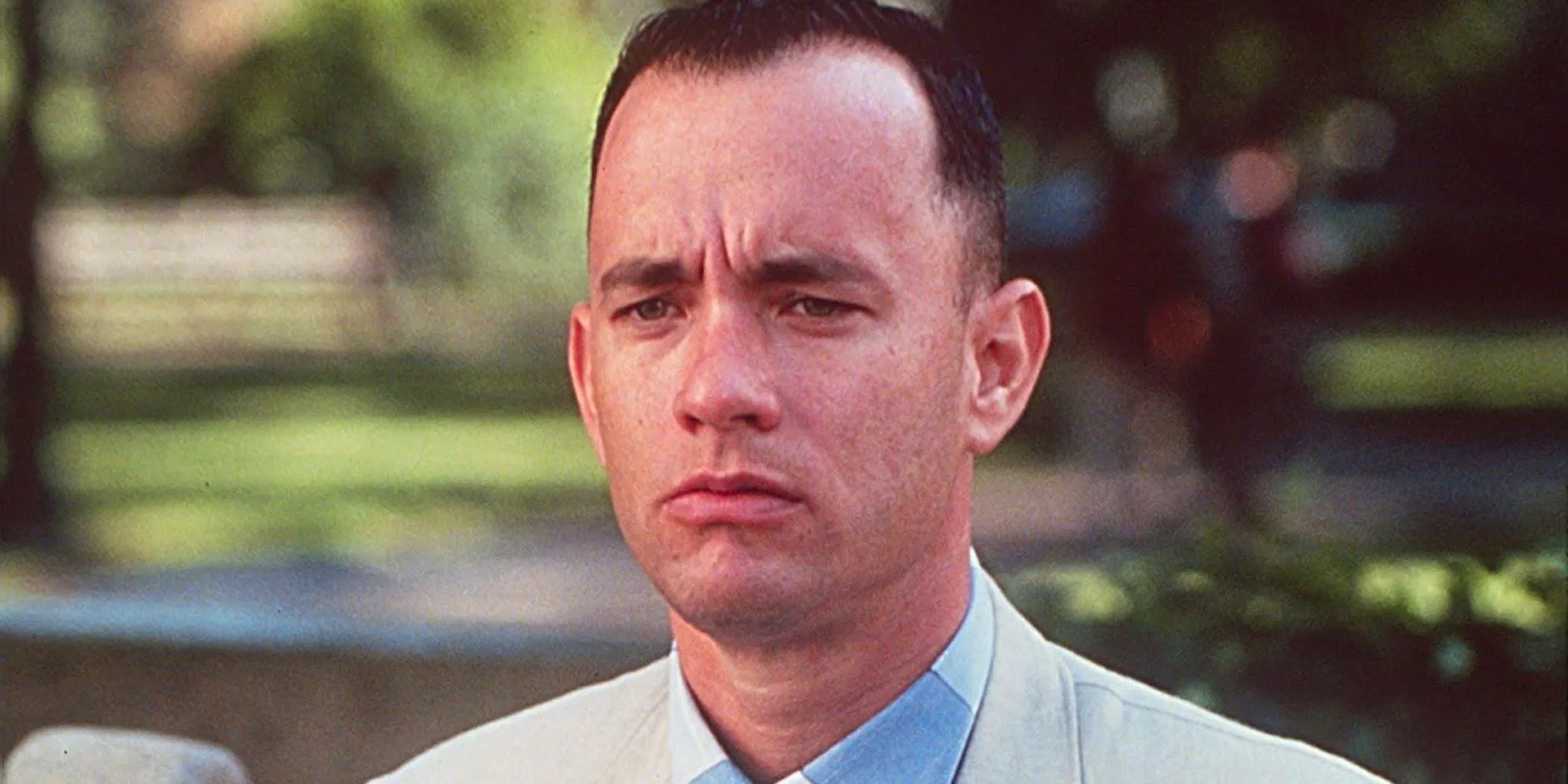 Forrest (Tom Hanks) on a bus bench in the opening scene of Forrest Gump  Image