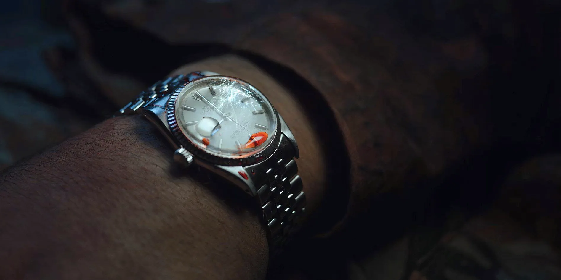 Francis' watch with a drop of blood on it at the end of Outside Image