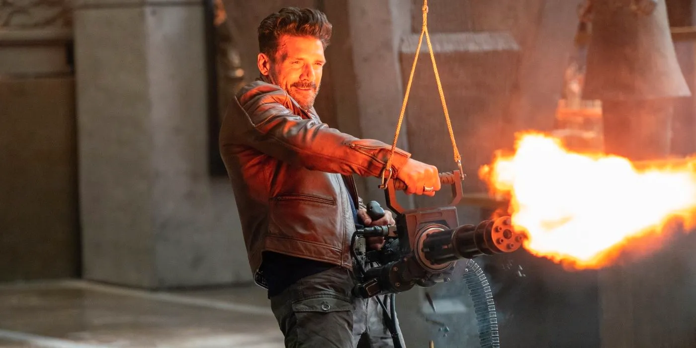 Frank Grillo wielding a lit blow torch in Boss level Image