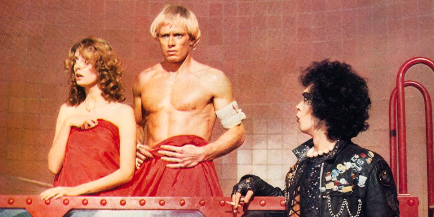 Frank N. Furter (Tim Curry) catches Rocky (Peter Hinwood) and Janet (Susan Sarandon) together in Rocky Horror Picture Show Image