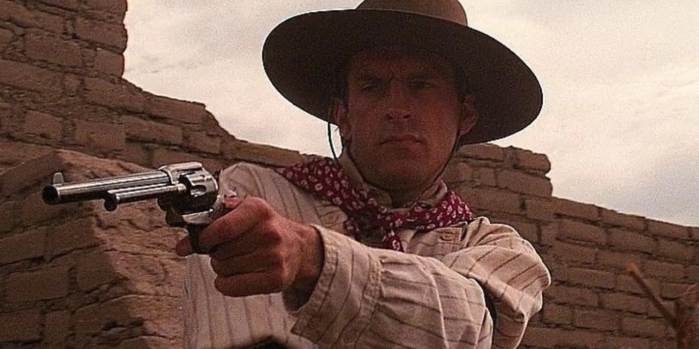 Frank Stilwell aiming his gun in Tombstone Image