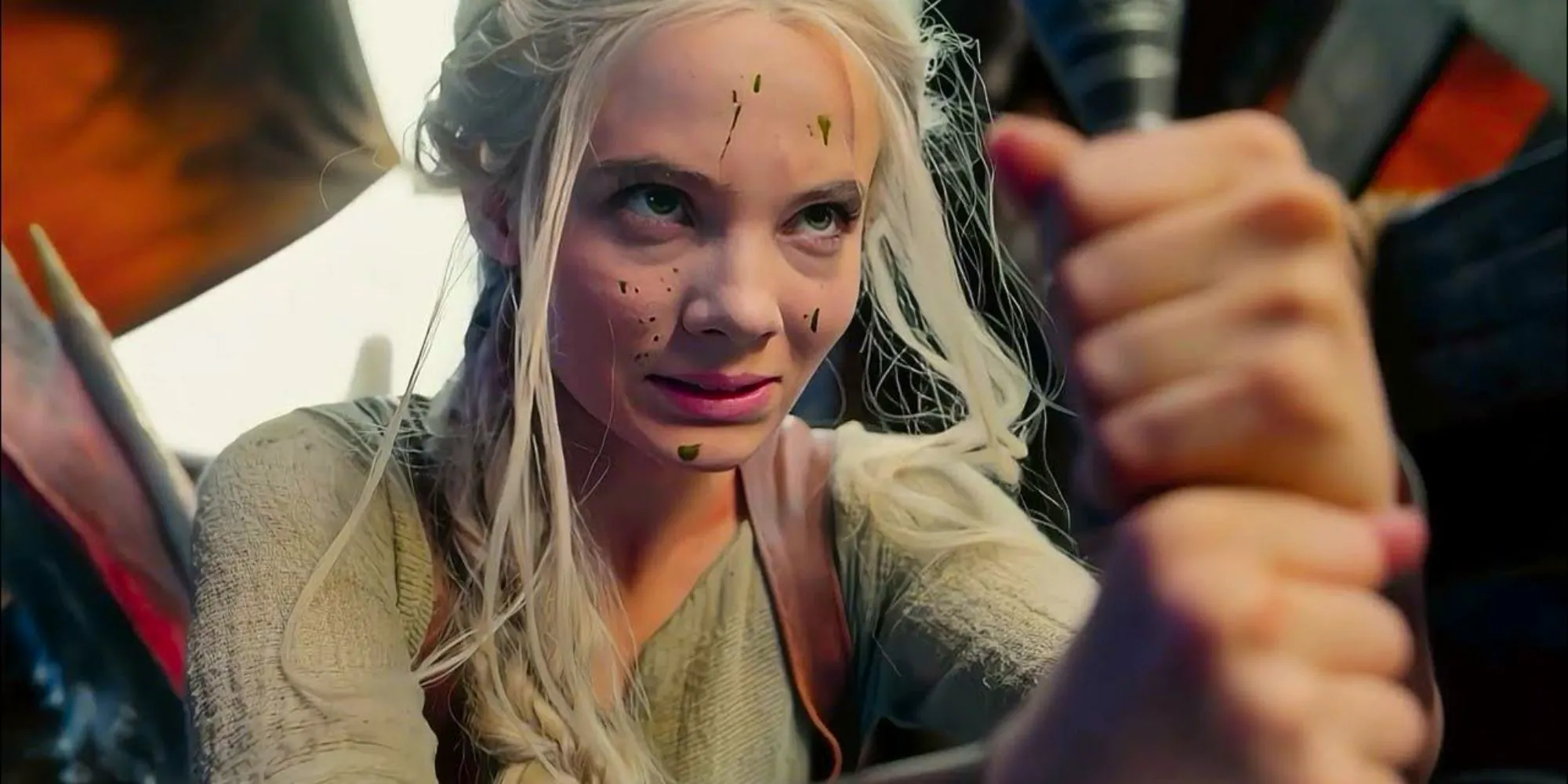 Freya Allan as Ciri looking up with goo on her face in The Witcher Image