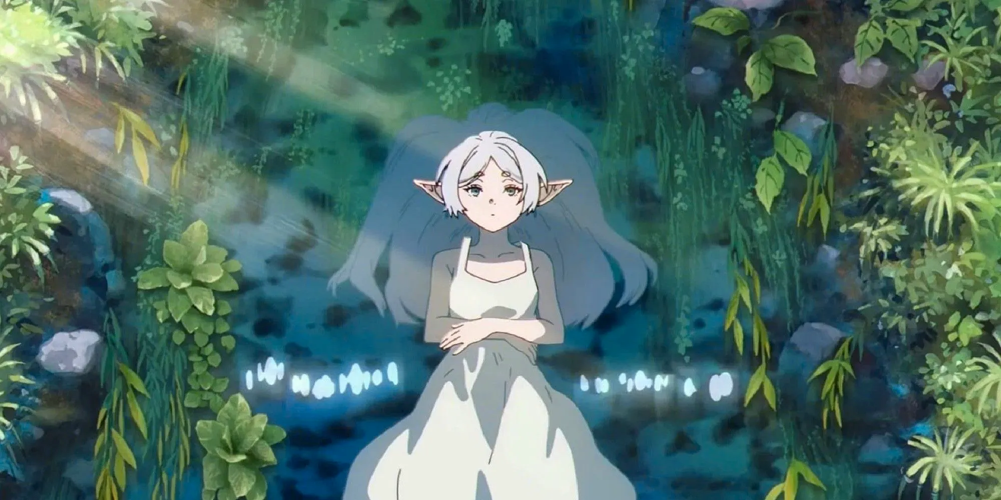 Frieren of Frieren: Beyond Journey's End floating in a stream in her white dress Image